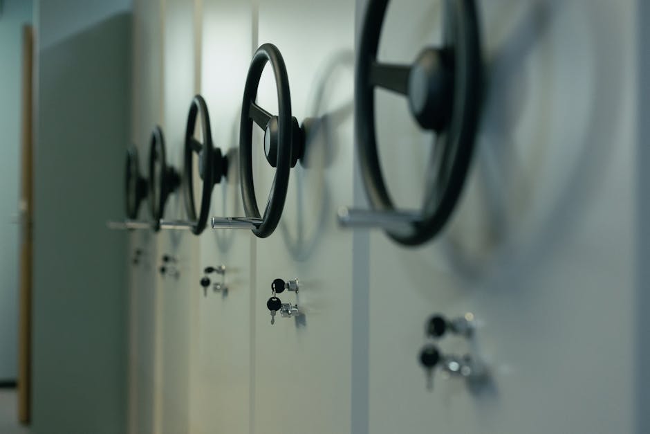 Close-up of industrial safes with manual locks and keys, highlighting security features.